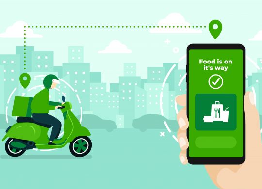 Food delivery service by scooter with courier. Hand holding mobile application tracking a delivery man on a moped. city skyline in the background.  What is Q-Commerce? Here is the complete retailer guide to Q-Commerce or Quick Commerce 570 scalia blog default